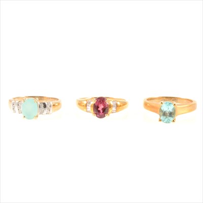 Lot 301 - A rubelite and diamond ring, a green and white stone ring and a pale blue stone ring.
