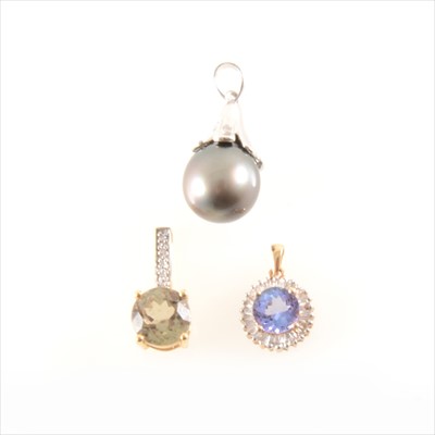 Lot 271 - A Tahitian pearl and diamond pendant, a circular tanzanite and diamond pendant, and a green and white stone pendant.