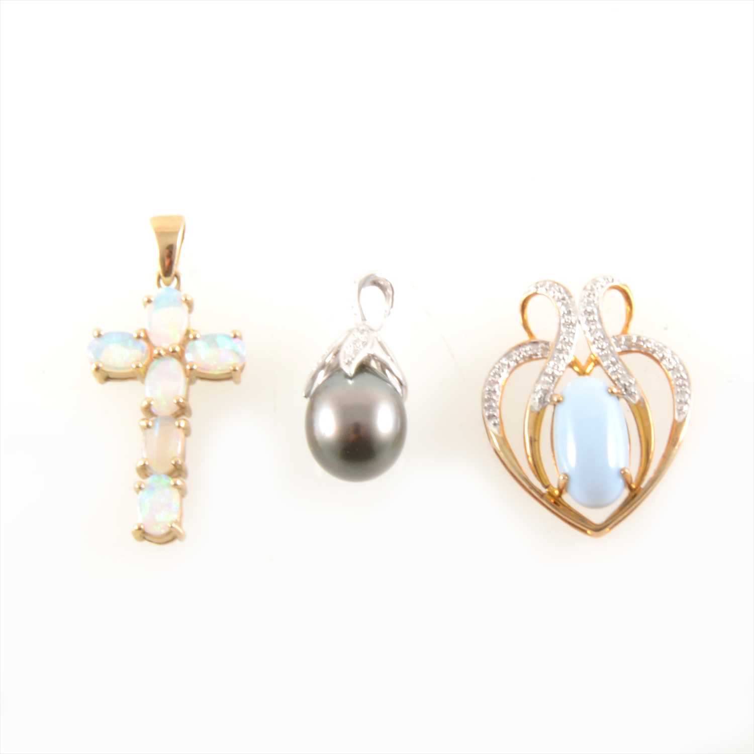 Lot 311 - A Mintabie Jelly Opal set cross pendant, a Tahitian pearl and diamond pendant and a pale blue and white stone pendant.