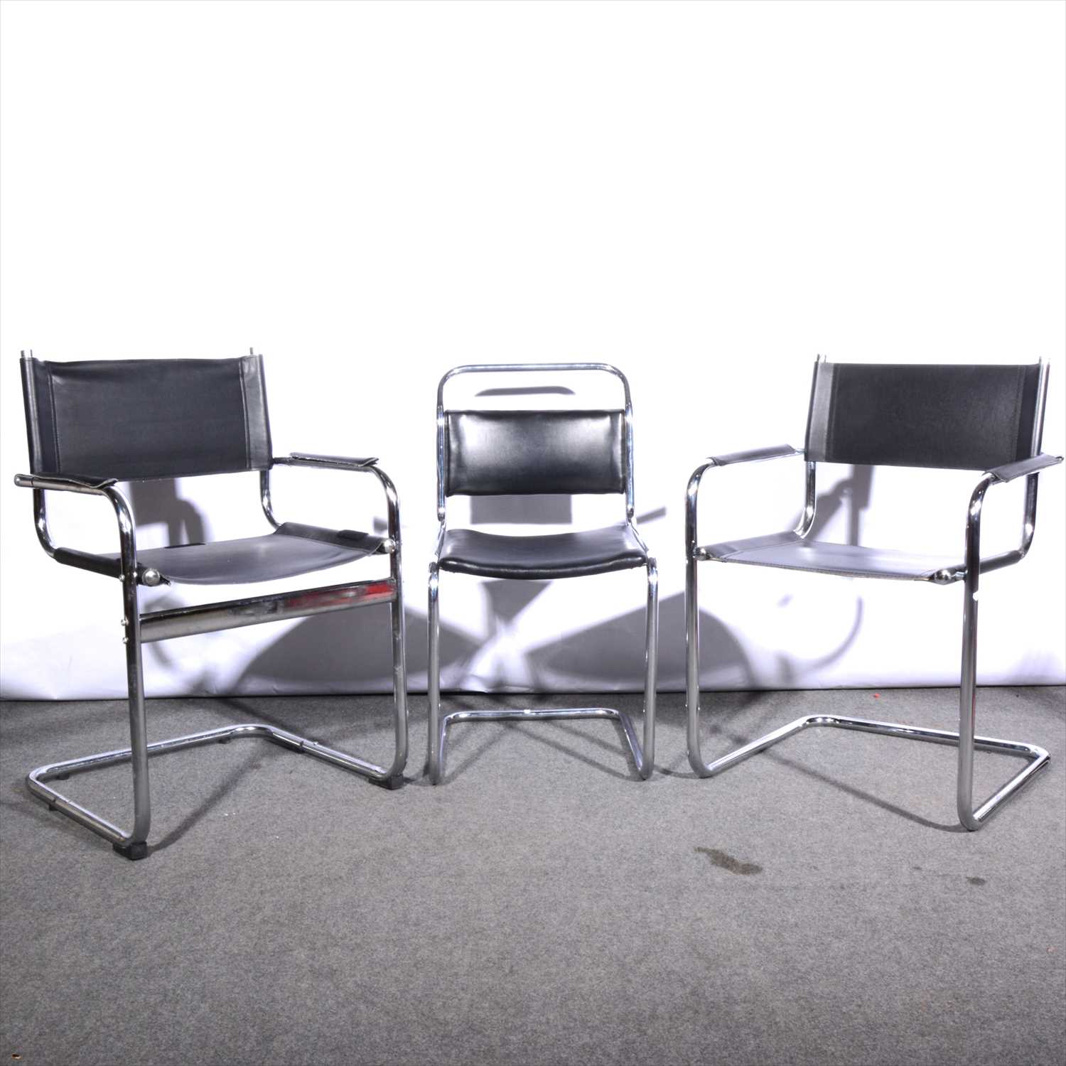 Lot 666 - Two similar Modernist cantilever tubular chairs and a similar single chair, Mid-Century.