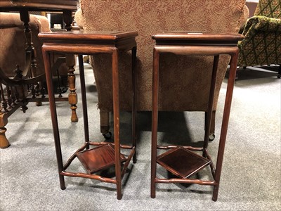 Lot 583 - A pair of Chinese hardwood stands