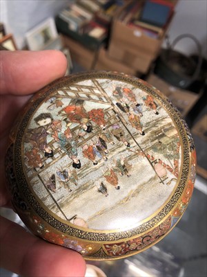 Lot 93 - A Japanese Satsuma kogo decorated with figures, decorated interior.