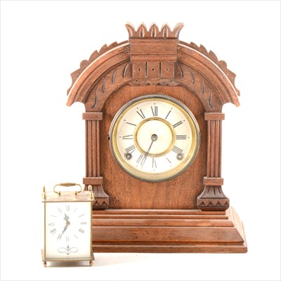 Lot 204 - An American stained wood mantel clock, ...