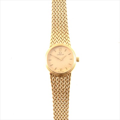 Lot 317 - Omega - a lady's 9 carat yellow gold bracelet watch.