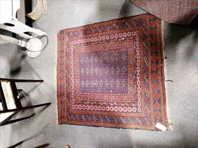 Lot 633 - Two near square rugs, one with lozenge field...