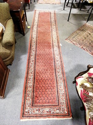 Lot 629 - A runner with pink ground, ...