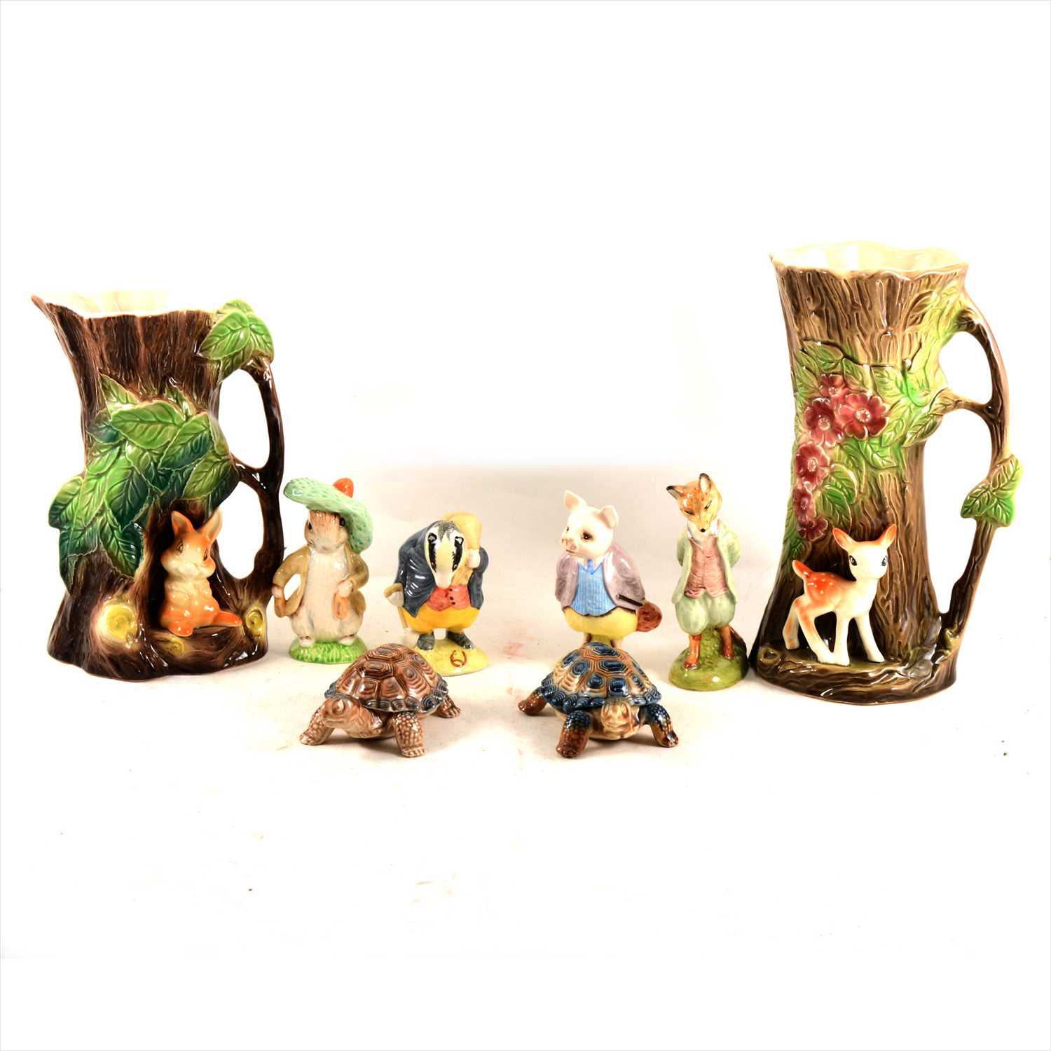 Lot 59 - A collection of Beatrix Potter figurines, and other collectable ceramics