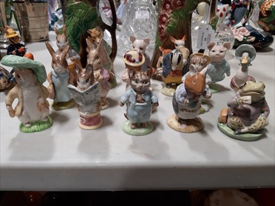 Lot 59 - A collection of Beatrix Potter figurines, and other collectable ceramics