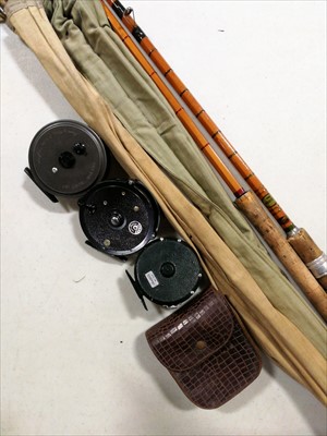 Lot 473 - Three centre pin fishing reels, and two split cane course fishing rods.