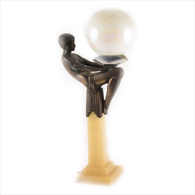 Lot 168 - After Max le Verrier, an Art Deco style onyx and spelter lamp