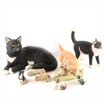 Lot 75 - A collection of cat-related figurines, collectors plates, and decorative items