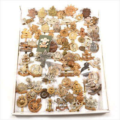 Lot 318 - A collection of seventy-one military cap badges plus buttons.