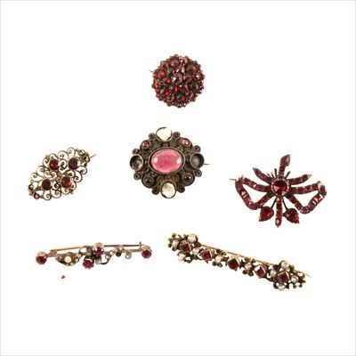 Lot 459 - Six Victorian and later brooches set with almandine garnets and similar red stones.