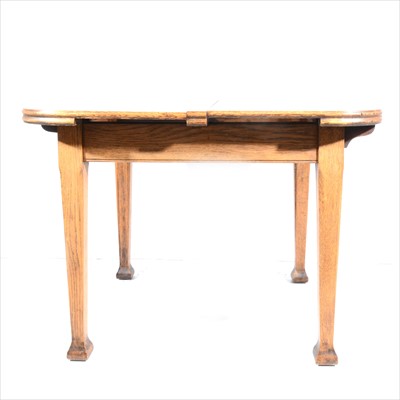 Lot 465 - An oak extending dining table