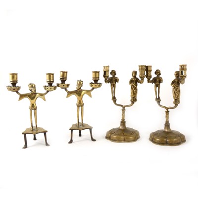 Lot 151 - Two pairs of cast brass Neo-Gothic style figural twin-light candlestands