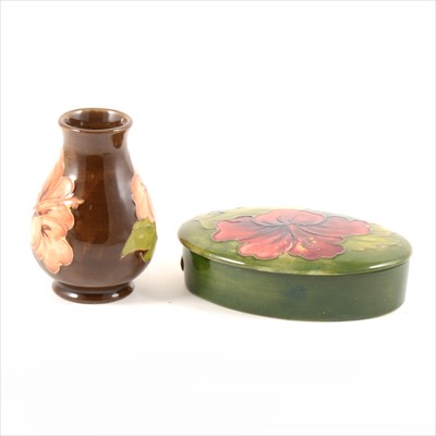 Lot 90 - A 'Hibiscus' design trinket box and vase, Moorcroft Pottery.