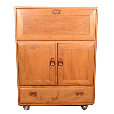 Lot 670 - An elm serving cabinet by Ercol, model 430