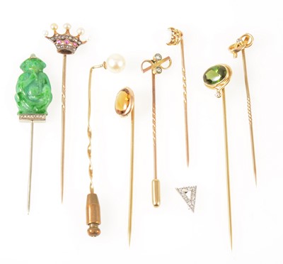 Lot 145 - Eight gemset tie pins and another triangular tie pin top
