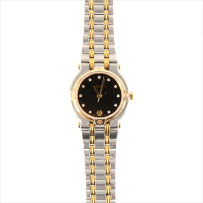 Lot 339 - Gucci - a lady's wrist watch with black dial.