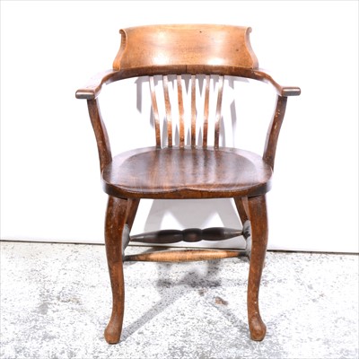 Lot 543 - A stained wood office chair, hoop back, with a...