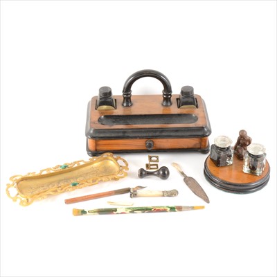 Lot 121 - A gilded metal pen tray, portable desk tidy, circular double inkwell and other small desk accessories.