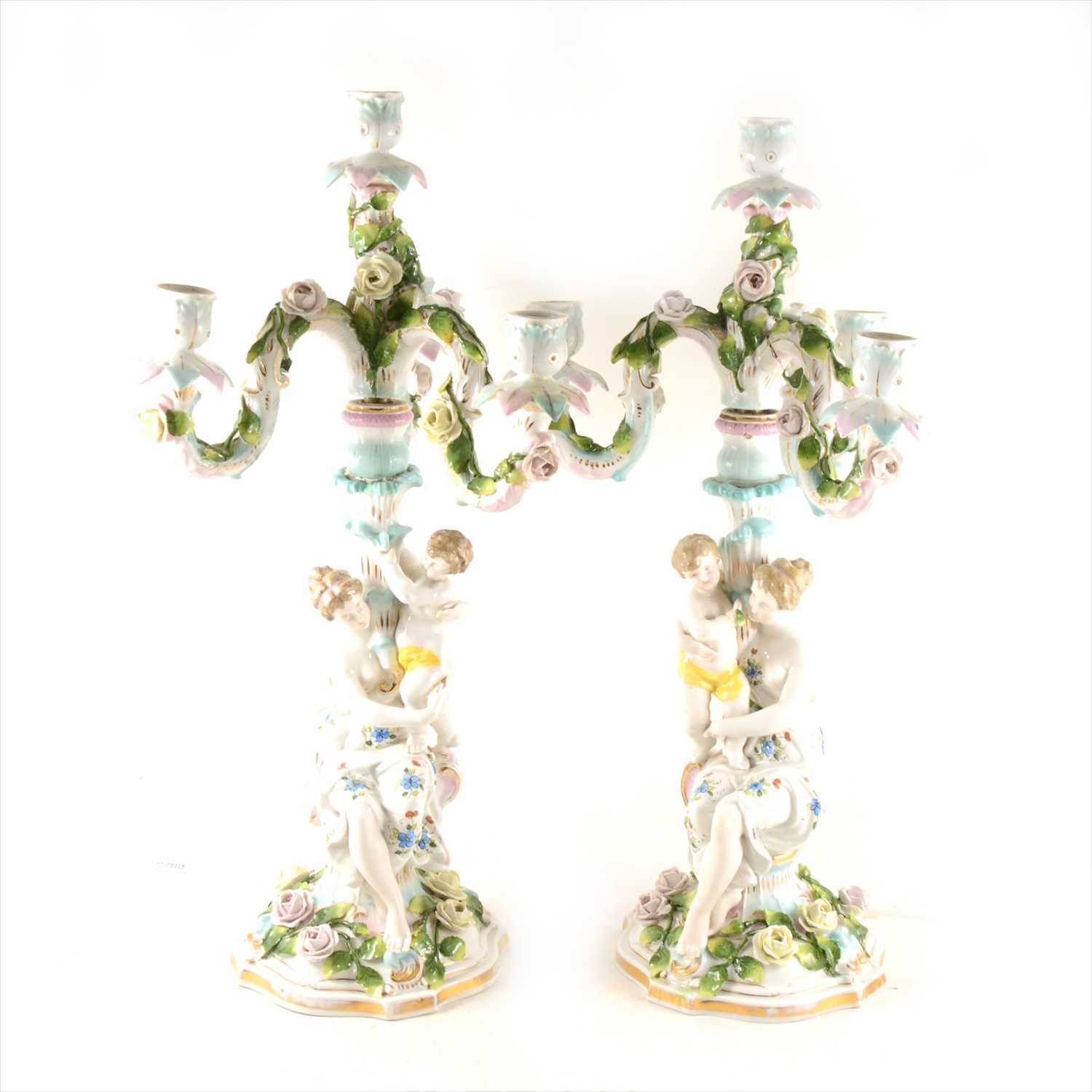 Lot 35 - Pair of Continental porcelain four-light figural candelabra