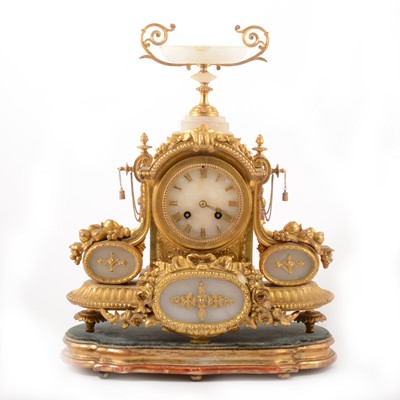 Lot 213 - A Louis XVI style gilt metal and alabaster mantel clock, mid 19th century