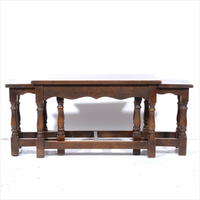 Lot 408 - A nest of three oak tables