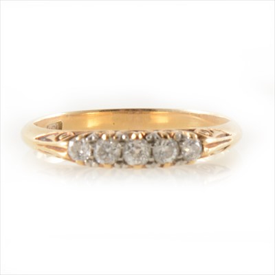 Lot 246 - A diamond five stone ring.