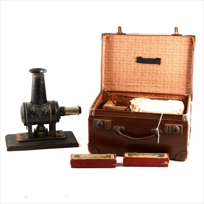 Lot 91 - Toy magic lantern, with original burner and two boxes of slides