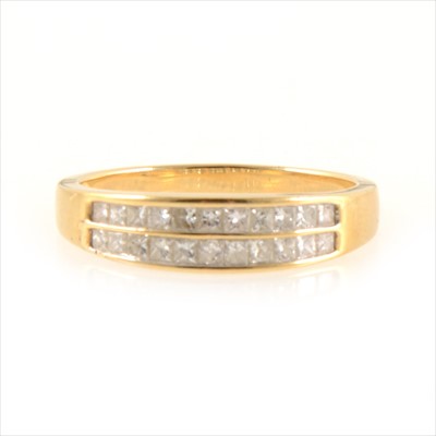 Lot 250 - A diamond two row eternity ring.