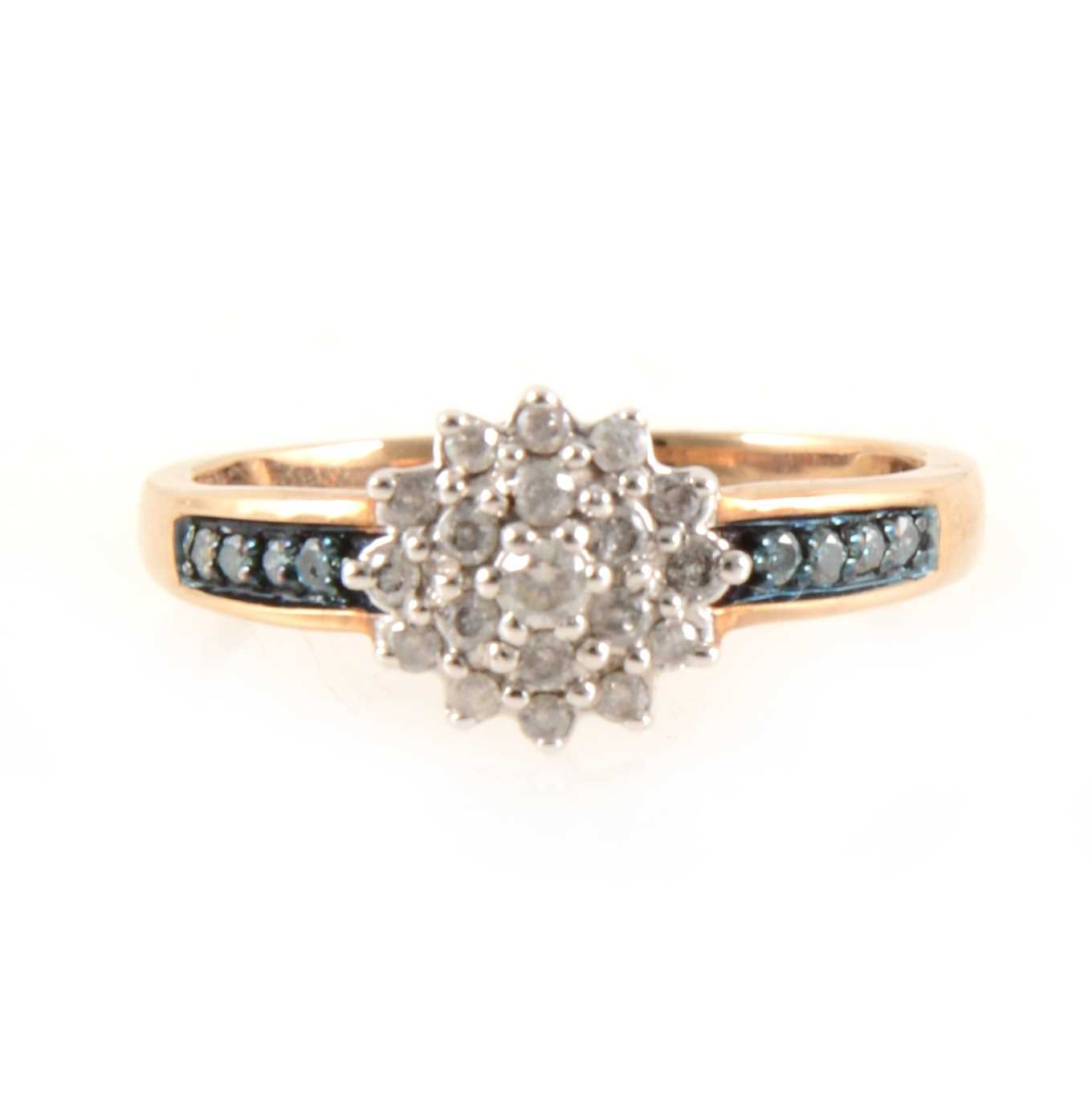 Lot 428 - A circular diamond cluster ring with blue diamond shoulders.