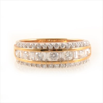 Lot 431 - A diamond three row eternity ring.