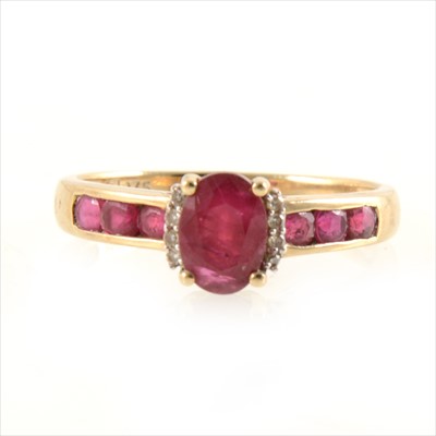 Lot 445 - A ruby solitaire ring with ruby shoulders.