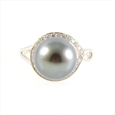 Lot 447 - A Tahitian pearl and diamond ring.