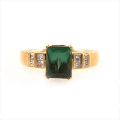 Lot 440 - A green tourmaline and diamond ring.