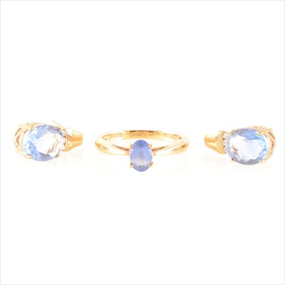 Lot 203 - A pair of blue and clear stone earrings and a blue stone solitaire ring.