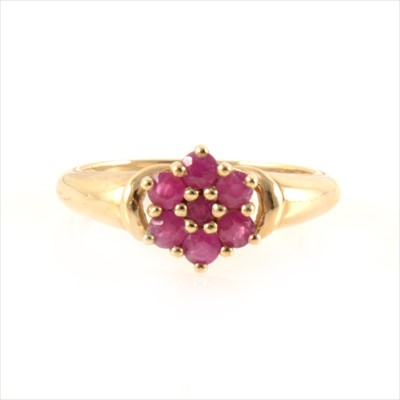 Lot 444 - A ruby cluster ring.