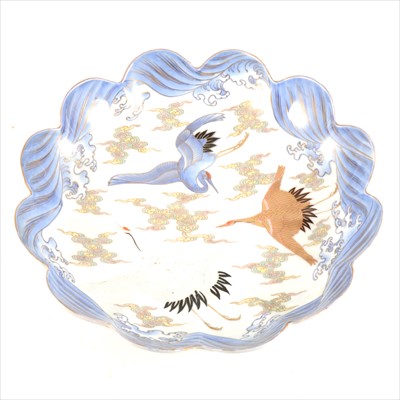 Lot 75 - A Japanese porcelain shallow dish, decorated with cranes