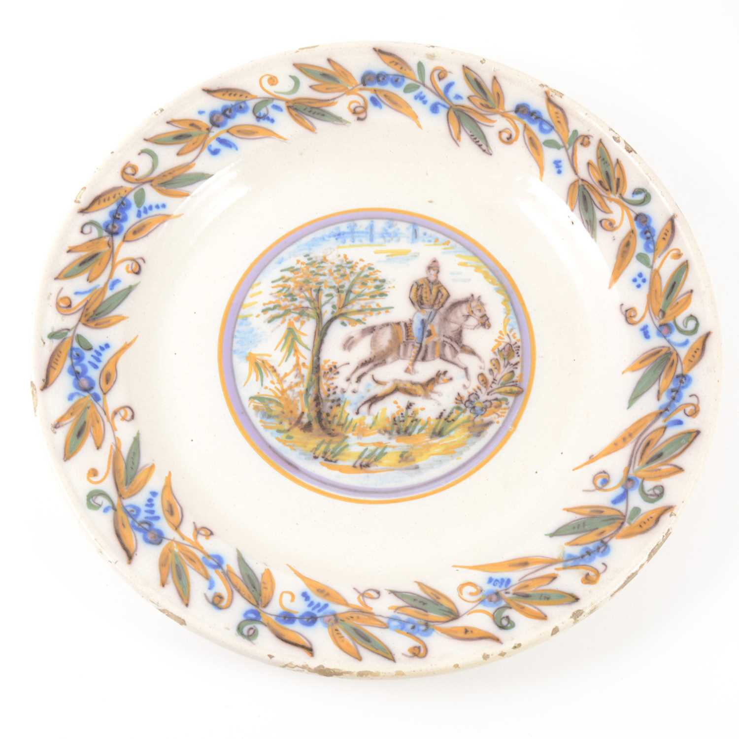 Lot 1056 - A French faience charger, 18th century
