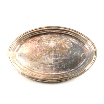 Lot 412 - An oval silver platter, plain polished design, 50cm x 34cm, London 1964, makers mark KL, approximate weight 50oz.