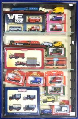 Lot 158 - A display case with model vehicles and trucks, including Lledo Days Gones, Corgi and others, mostly boxed.