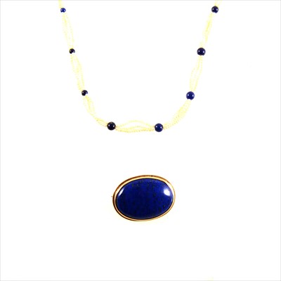 Lot 462 - A lapis lazuli brooch and seed pearl necklace with lapis beads.