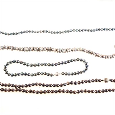 Lot 470 - Four cultured pearl necklaces, greys, black and a natural colour simulated pearl necklace.