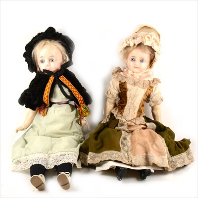 Lot 140 - Two Victorian wax over composition head dolls, straw filled bodies, both in original outfits, both approximately 63cm.