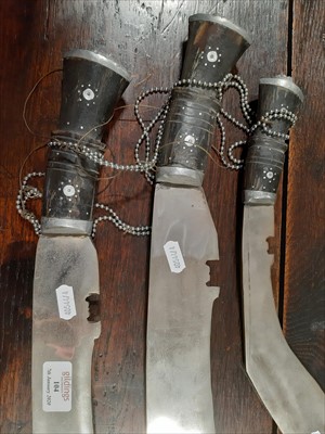 Lot 104 - Three modern kukri knives.