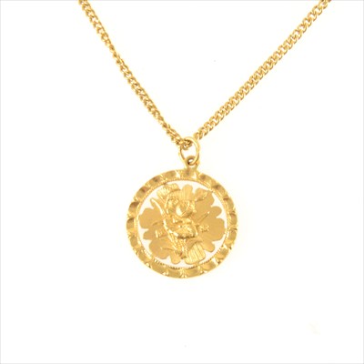 Lot 308 - A yellow metal pendant and chain with Chinese text.