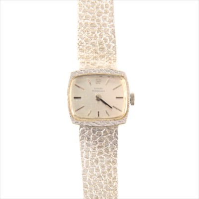 Lot 337 - Girard-Perigueux - a lady's white metal bracelet watch, stamped 750.