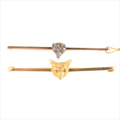 Lot 307 - A 9 carat yellow gold fox mask bar brooch, and another similar set with rose cut diamonds.