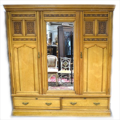 Lot 424 - A Victorian ash triple wardrobe